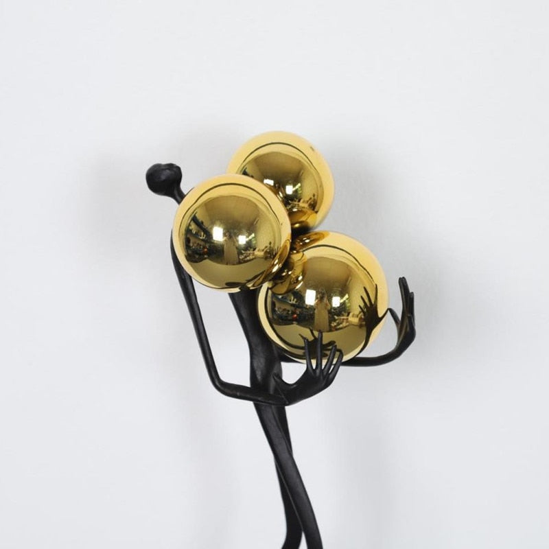 Man and Golden Ball Abstract Figures